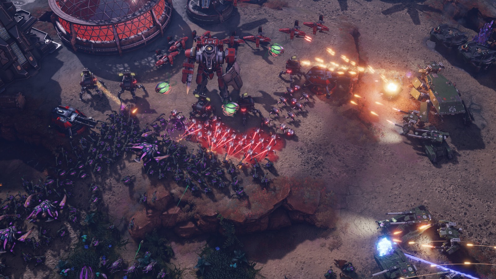 A three-way engagement with mechs, swarming infantry and armour trading fire across open ground